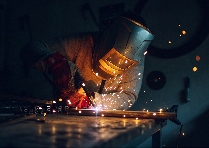 Welder working with sparks flying